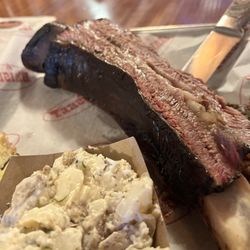 Brisket - Their Dino Beef rib and potato salad. It is so tender and juicy and you can cut it with a fork. It is super delicious.