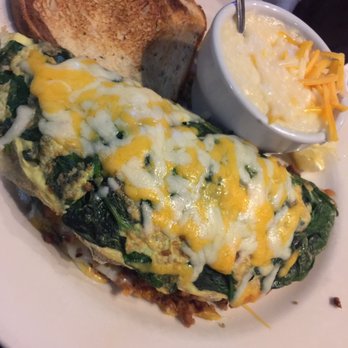 Jerry's Grille - Spinach and shrimp omlet with cheese grits and an English muffin. - American Near Me - Jacksonville, Florida Jerry's Grille - Spinach and shrimp omlet with cheese grits and an English muffin. - American Near Me - Jacksonville, Florida
