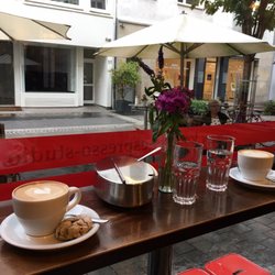 Kessels Espresso Studio - Two cappucinos with a soft little pistachio dessert on the side