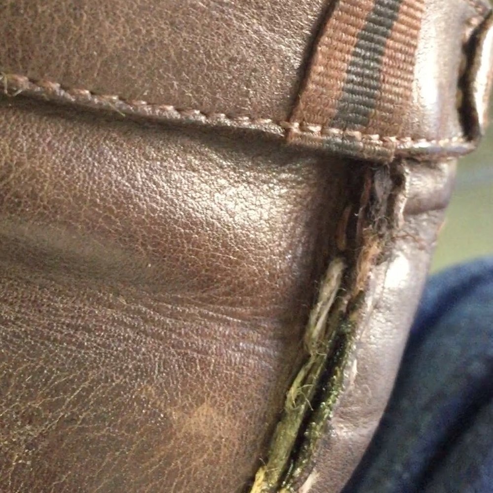 This is how he "repaired" my shoe: by carelessly adding glue. This is how he "repaired" my shoe: by carelessly adding glue.