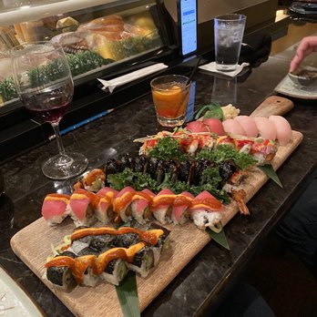 Sushi Zen - Array of sushi rolls and nigiri rolls accompanied by a half drank glass of Pinot Noir and an Old Fashioned, yum! - Sushi Bars Near Me - Brighton, Michigan Sushi Zen - Array of sushi rolls and nigiri rolls accompanied by a half drank glass of Pinot Noir and an Old Fashioned, yum! - Sushi Bars Near Me - Brighton, Michigan