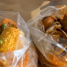 Shrimp with okra and corn. Clams with potatoe and assuage Shrimp with okra and corn. Clams with potatoe and assuage