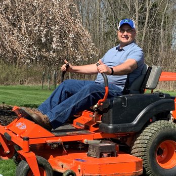 Brinley's Mowing and Landscaping - a man sitting on a lawn mower - Lawn Services Near Me Brinley's Mowing and Landscaping - a man sitting on a lawn mower - Lawn Services Near Me