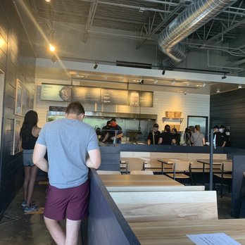 CAVA - Socially distant stickers and everyone wearing masks. - Mediterranean Near Me - Denver, Colorado