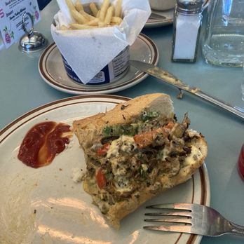 Steuben's Uptown - Cheesesteak (loaded with peppers, onions, and mushrooms), fries, and the remnants of tomato soup in the background. - Diners Near Me - Denver, Colorado Steuben's Uptown - Cheesesteak (loaded with peppers, onions, and mushrooms), fries, and the remnants of tomato soup in the background. - Diners Near Me - Denver, Colorado