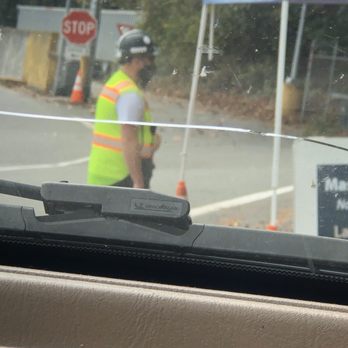 Algona Transfer Station - Employee wearing a mask that reads 'this mask is useless' - Hazardous Waste Disposal Near Me - Algona, Washington