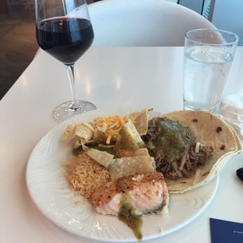 The Centurion Lounge - Typical lunch - salmon over polenta, fresh brisket with salsa verde accompanied by a glass of cabernet and water. - Airport Lounges Near Me - Dallas, Texas