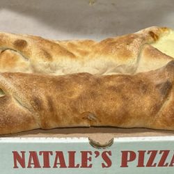 Natales Pizza & Restaurant - Stromboli Sausage, onion, xtra cheese and a pepperoni Stromboli.