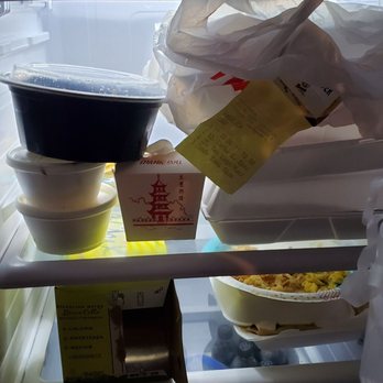 Gra Pow - Proof of the unfinished dish. Theirs is the black circular container and Chinese to go box. - Thai Near Me - Riverside, California