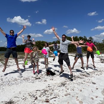 Captain Craig's Adventures - Customers jumping for joy while shelling on the beach - Historical Tours Near Me - Ochopee, Florida