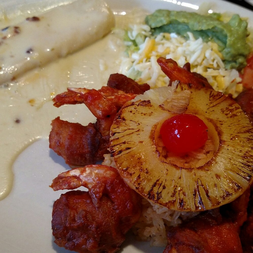 El Patio - a plate of food with meat, rice, and a pineapple - Mexican Near Me - Keithville, Louisiana El Patio - a plate of food with meat, rice, and a pineapple - Mexican Near Me - Keithville, Louisiana