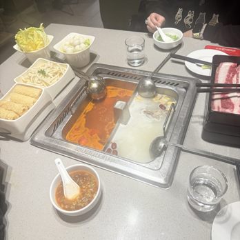 Haidilao Hot Pot - tomato and pork bone soup base. udon. quail eggs. beef. - Chinese Near Me - Markham, Ontario