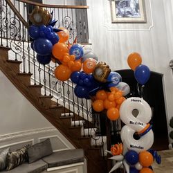 Bertie’s Balloons And Backdrops - Mets themed birthday banister balloons