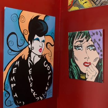 Canvas - a red wall with paintings on it - Lounges Near Me - Memphis, Tennessee