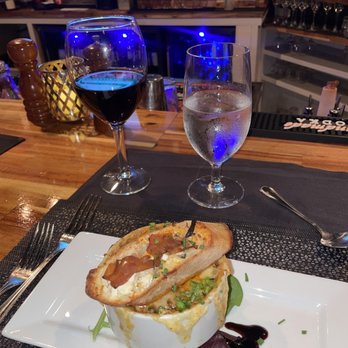 Sage Room - a plate of food and a glass of wine - New American Near Me - Hilton Head Island, South Carolina Sage Room - a plate of food and a glass of wine - New American Near Me - Hilton Head Island, South Carolina