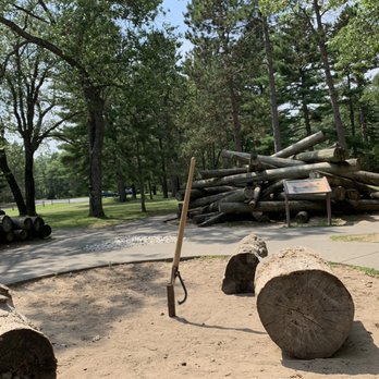 Lumberman's Monument Visitor Center - Take a turn moving the massive logs with an old-time lumberman tool at this interactive site. - Visitor Centers Near Me - Oscoda, Michigan