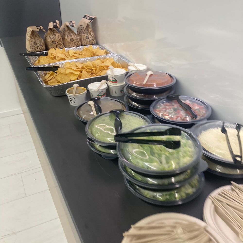 District Taco - a variety of food items on a counter - Mexican Near Me - Arlington, Virginia