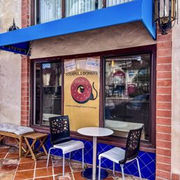 Exterior outside entrance of Sourpuss Donuts - Store front seating - San Diego, California Exterior outside entrance of Sourpuss Donuts - Store front seating - San Diego, California