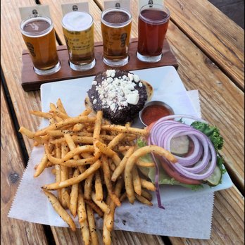 Mountain Rambler Brewery - My "Burger," from the dinner menu, optional order of fries, and "flight" of beer.  Yes, that's goat cheese on the burger!  Love it!!! - New American Near Me - Bishop, California
