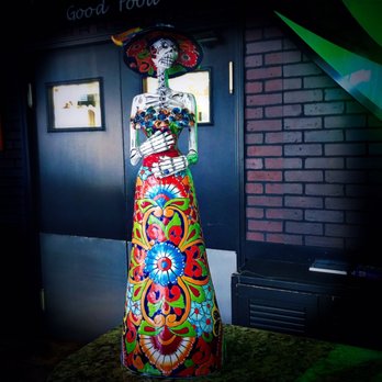 Casa Agave Mexican Cuisine - a brightly colored statue of a woman - Mexican Near Me - Painesville, Ohio