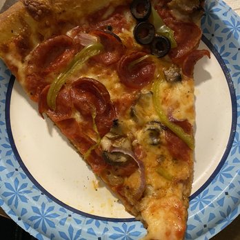 Pie Society - A slice of The Handshake Pizza to show the size - Pizza Near Me - San Marcos, Texas Pie Society - A slice of The Handshake Pizza to show the size - Pizza Near Me - San Marcos, Texas