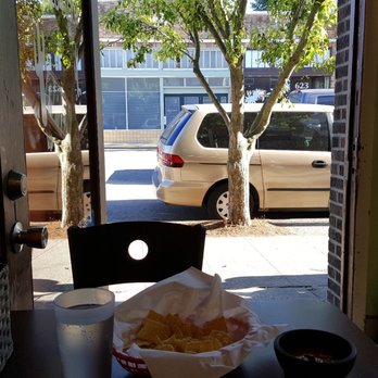 Malena's Taco Shop - My view by the door towards W McGraw, nice breeze (6/23/17) - Tacos Near Me - Seattle, Washington