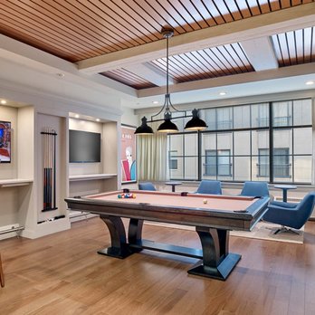 The Left Bank - Game room with billiards table and large screen TVs accessible for gaming system set up - Apartments Near Me - Philadelphia, Pennsylvania The Left Bank - Game room with billiards table and large screen TVs accessible for gaming system set up - Apartments Near Me - Philadelphia, Pennsylvania