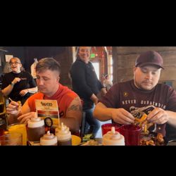 Georgia Boys BBQ - The boys look miserable, but they had just gotten started. Their bellies didn't know of misery yet...