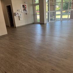 American Carpet & Rug - Glue Down LVP for Commercial application.