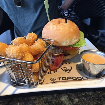 Topgolf - Can't go wrong with a beef bacon burger with tots! - Golf Near Me - Houston, Texas Topgolf - Can't go wrong with a beef bacon burger with tots! - Golf Near Me - Houston, Texas