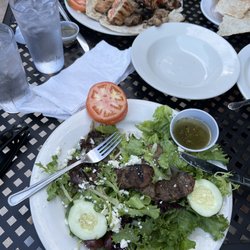 Aladdin's Natural Eatery - A half eaten gyro special, and a mixed grill special