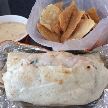 QDOBA Mexican Eats - Burnt chips and a burrito ripped at the seams... It was unappetizing as it looks - Mexican Near Me - Detroit, Michigan