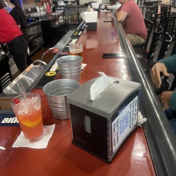 The Dirty Buffalo - Bone bucket and bar area with a wooo hooo drink - Chicken Wings Near Me - Virginia Beach, Virginia