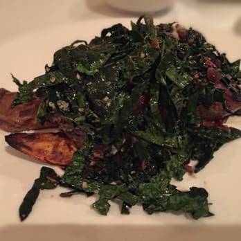 Ecco Midtown - Grilled pork tenderloin on sweet potatoes and topped with kale - Modern European Near Me - Atlanta, Georgia