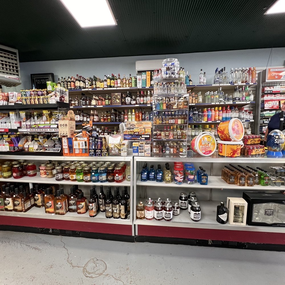 Old Highway Market - a woman standing in front of the shelves - Grocery Near Me - Brooklyn, Michigan
