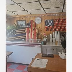 Dairy Bar Mr B's - American flags behind the counter. This place is very patriotic love this place