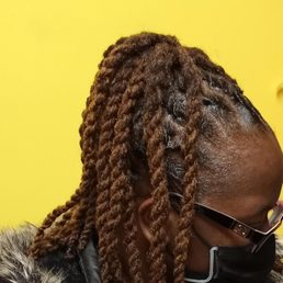 Twisted Natural dreadlocks in a ponytail Twisted Natural dreadlocks in a ponytail