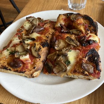 Novanta Café - two slices of pizza on a plate - Italian Near Me - Montreal, Quebec Novanta Café - two slices of pizza on a plate - Italian Near Me - Montreal, Quebec