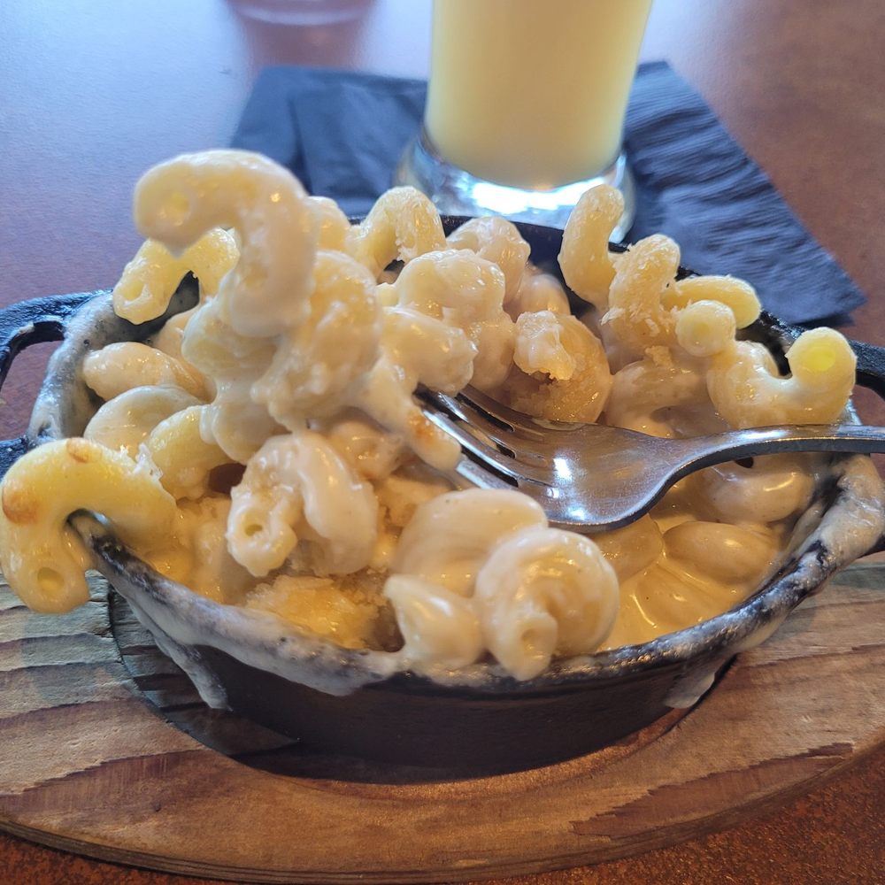 Brick and Bourbon - Mac n cheese (side portion). Next time, I will get the regular entree dish because it was SOOOOO good! Very cool atmosphere! - Cocktail Bars Near Me - Eden Prairie, Minnesota