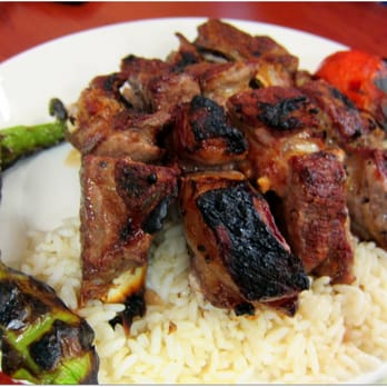 Harran Restaurant - Super meaty lamb ribs - delicious, not gamey at all, great grilled flavor.  w/grilled tomato and pepper - Turkish Near Me - London, XGL