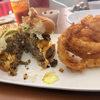 The Roost Cafe - Rooster Booster burger with onion rings - Diners Near Me - Eustace, Texas The Roost Cafe - Rooster Booster burger with onion rings - Diners Near Me - Eustace, Texas
