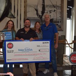 Earl W. Johnston Roofing - Here we are presenting a big check to Make-A-Wish from our annual fundraising campaign!