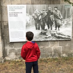 Sachsenhausener Straße - I walked up and saw this boy reading and his bright red jacket