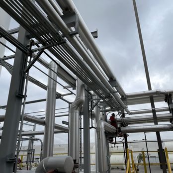 Amero Electric - a man in a hard hat and hard hat standing in front of pipes - Electricians Near Me - Montclair, California Amero Electric - a man in a hard hat and hard hat standing in front of pipes - Electricians Near Me - Montclair, California