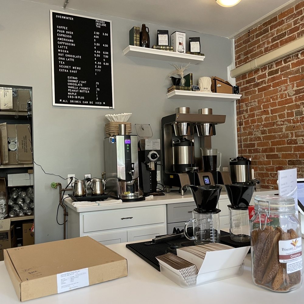 a coffee shop with a brick wall a coffee shop with a brick wall