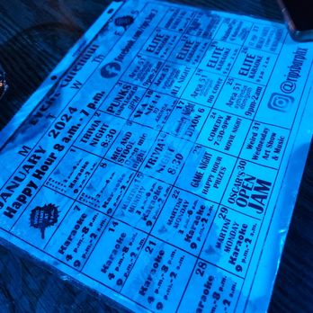 Rips Bar - a menu on a wooden table - Dive Bars Near Me - Phoenix, Arizona