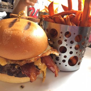 Moonstruck Eatery - My Breakfast Burger on a regular bun. Egg, American Cheese and Bacon. Sweet Potato Fries $2 extra. 03/25/17 - American Near Me - New York, New York