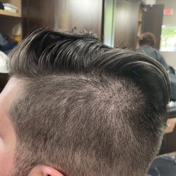 Roosters Men's Grooming Center