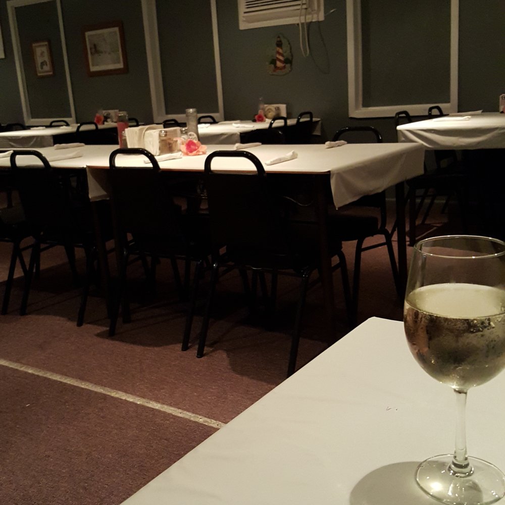a glass of wine on a table