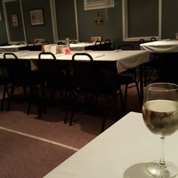 a glass of wine on a table